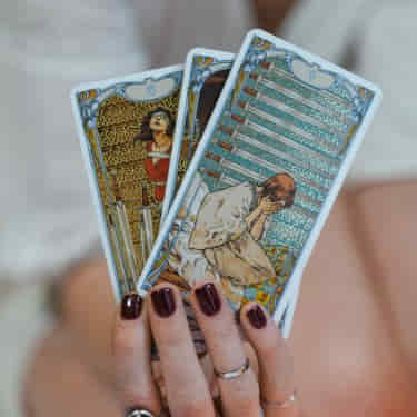 tarot cards in a readers hands